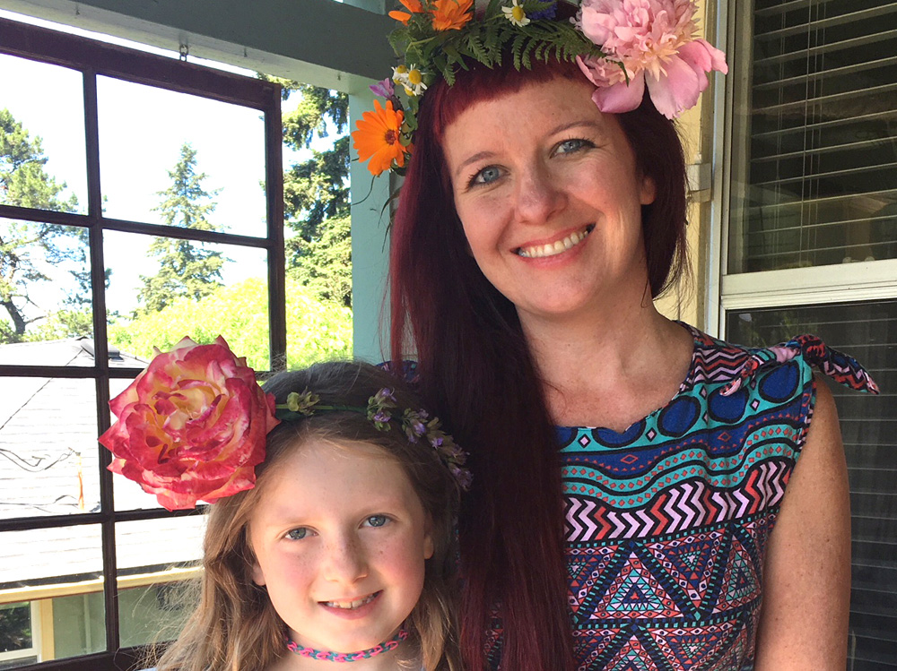 Sock It to Me Cool Girl Julz Nally with Daughter Juniper, both in flower crowns as featured image.